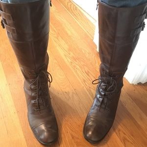Knee-high leather boots with lacing and buckles